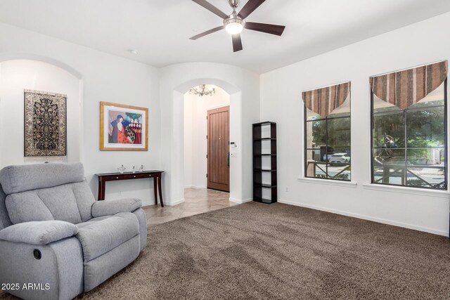 800 W Sycamore Ct, Litchfield Park, AZ 85340 - sitting room featuring a ceiling fan, arched walkways, carpet floors, and baseboards