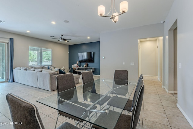 dining space with light tile patterned flooring, baseboards, ceiling fan with notable chandelier, visible vents, and recessed lighting