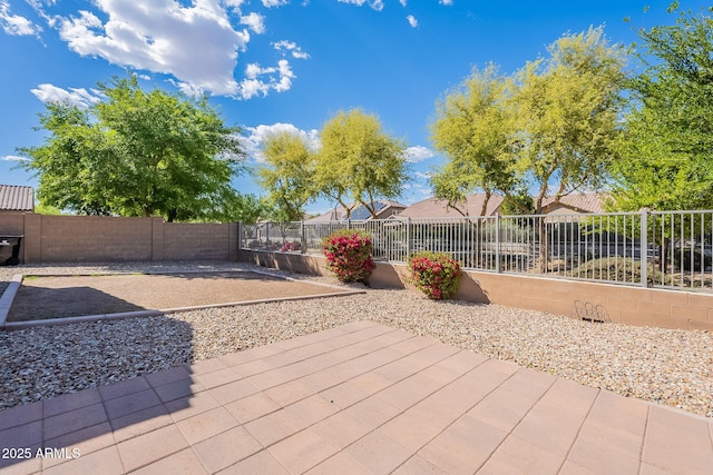 wooden deck featuring a patio and a fenced backyard