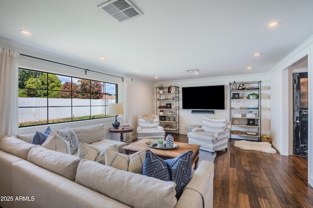 living area with visible vents, recessed lighting, dark wood-style floors, and ornamental molding
