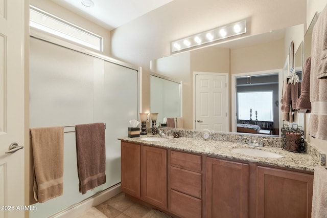 bathroom featuring tile patterned floors, vanity, and an enclosed shower