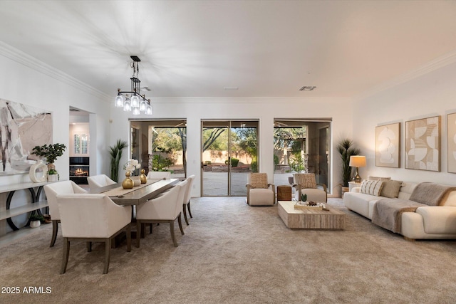 11193 N 121st Way, Scottsdale, AZ 85259 - dining room featuring ornamental molding, a chandelier, and carpet floors