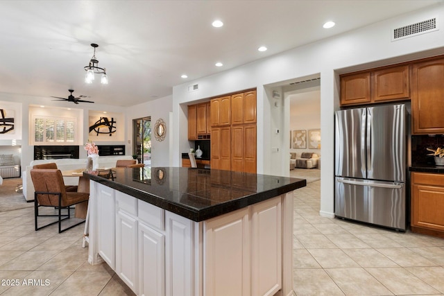 11193 N 121st Way, Scottsdale, AZ 85259 - kitchen featuring freestanding refrigerator, tile countertops, light tile patterned floors, a center island, and recessed lighting