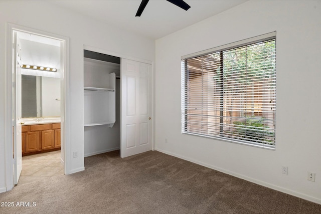 11193 N 121st Way, Scottsdale, AZ 85259 - unfurnished bedroom with light colored carpet, a closet, ensuite bathroom, and a ceiling fan