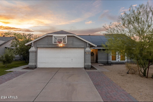 ranch-style home with a garage