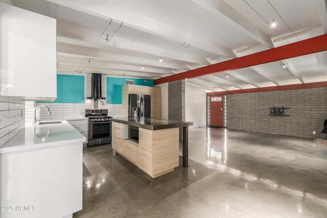 5739 N 11th St, Phoenix, AZ 85014 - kitchen with appliances with stainless steel finishes, a sink, modern cabinets, finished concrete flooring, and brick wall