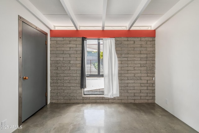 5739 N 11th St, Phoenix, AZ 85014 - empty room with finished concrete flooring and beam ceiling
