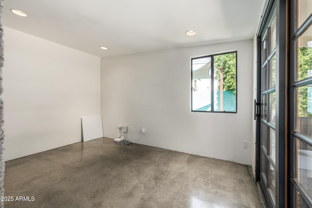5739 N 11th St, Phoenix, AZ 85014 - empty room featuring finished concrete floors and recessed lighting