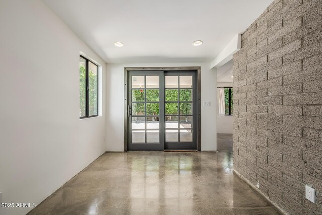 5739 N 11th St, Phoenix, AZ 85014 - doorway to outside featuring finished concrete floors and recessed lighting