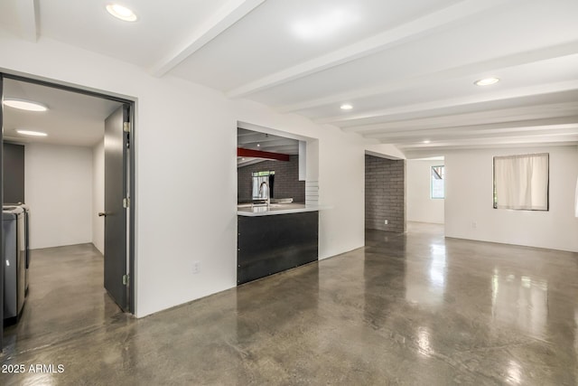 5739 N 11th St, Phoenix, AZ 85014 - unfurnished living room with concrete floors, beamed ceiling, recessed lighting, and a sink