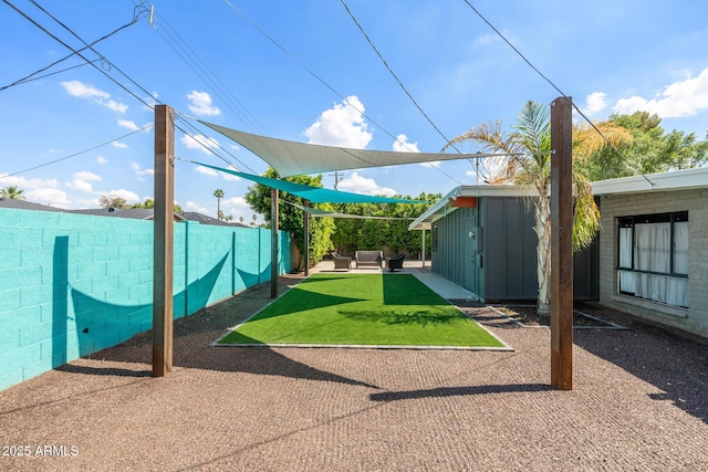 5739 N 11th St, Phoenix, AZ 85014 - fenced backyard with a patio, an outbuilding, and outdoor lounge area