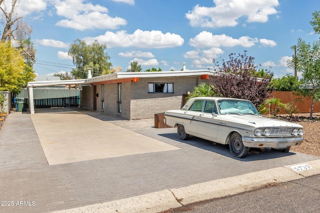 5739 N 11th St, Phoenix, AZ 85014 - view of front of home featuring concrete driveway and an attached carport