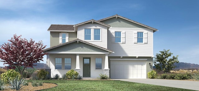 craftsman inspired home featuring a front lawn, an attached garage, and driveway