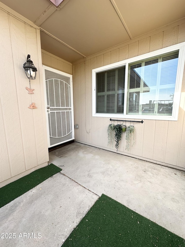 entrance to property featuring a patio area