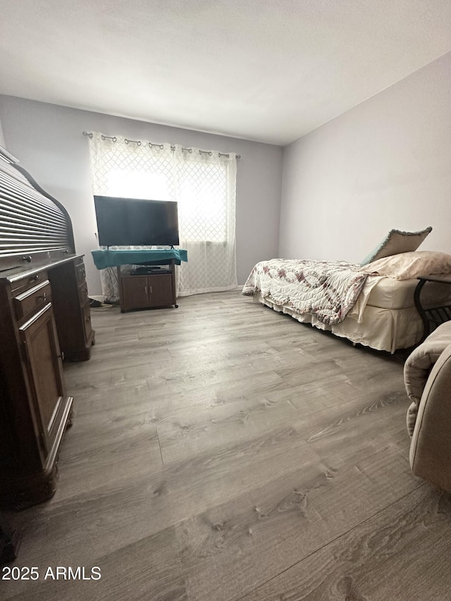 bedroom with light wood-type flooring