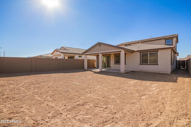 back of property featuring a patio