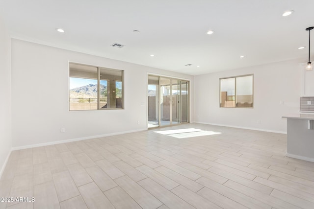 spare room with light hardwood / wood-style flooring