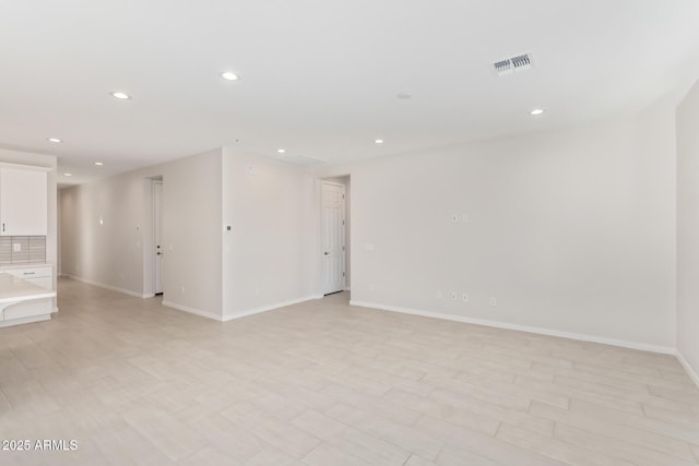 spare room featuring light wood-type flooring