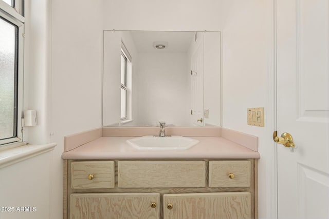 bathroom featuring vanity and a wealth of natural light