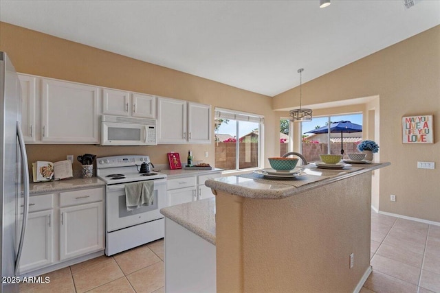 4459 E Desert Wind Dr, Phoenix, AZ 85044 - kitchen featuring white appliances, light tile patterned flooring, white cabinets, and vaulted ceiling