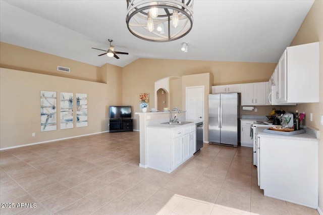 4459 E Desert Wind Dr, Phoenix, AZ 85044 - kitchen featuring stainless steel appliances, light countertops, light tile patterned flooring, a ceiling fan, and high vaulted ceiling