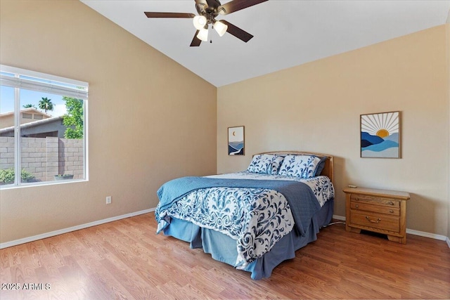 4459 E Desert Wind Dr, Phoenix, AZ 85044 - bedroom featuring lofted ceiling, wood finished floors, and a ceiling fan