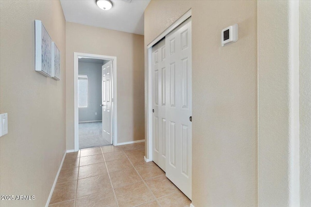 4459 E Desert Wind Dr, Phoenix, AZ 85044 - hall featuring light tile patterned floors and baseboards