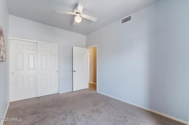 4459 E Desert Wind Dr, Phoenix, AZ 85044 - unfurnished bedroom featuring carpet flooring, a closet, and a ceiling fan