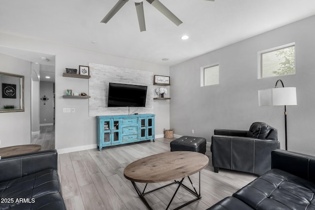 living room with a ceiling fan, light wood-type flooring, baseboards, and recessed lighting