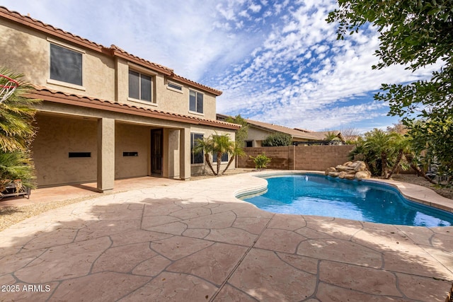 view of pool with a fenced in pool, a fenced backyard, and a patio