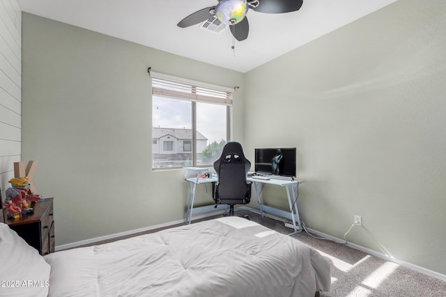 carpeted bedroom with a ceiling fan, visible vents, and baseboards