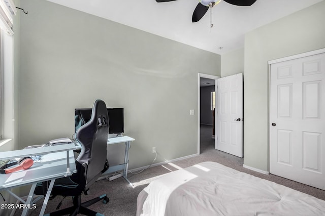 bedroom with light carpet, ceiling fan, and baseboards