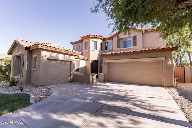 mediterranean / spanish-style house featuring driveway and stucco siding