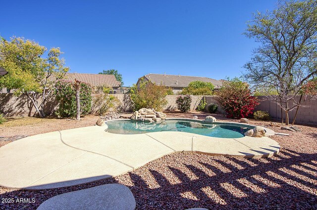 view of pool featuring a fenced backyard and a patio