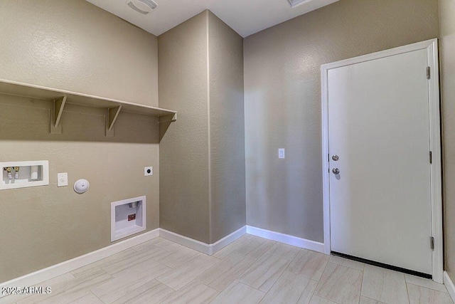 laundry area featuring washer hookup, hookup for an electric dryer, gas dryer hookup, laundry area, and baseboards