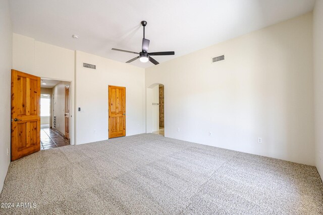 unfurnished bedroom featuring carpet and ceiling fan