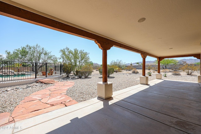 view of patio featuring a fenced in pool