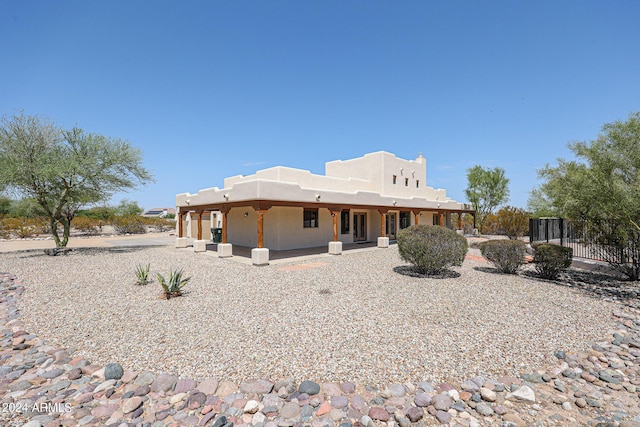 back of property featuring a patio