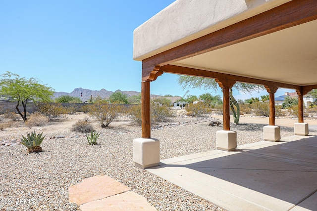 exterior space featuring a patio and a mountain view