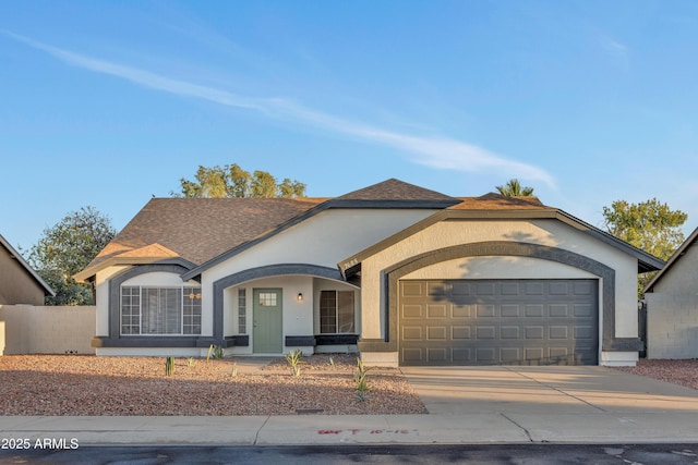 7685 W San Miguel Ave, Glendale, AZ 85303 - view of front facade with concrete driveway, an attached garage, stucco siding, and a shingled roof