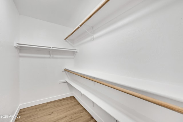 7685 W San Miguel Ave, Glendale, AZ 85303 - walk in closet featuring light wood-type flooring