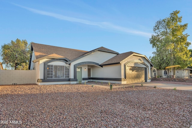 7685 W San Miguel Ave, Glendale, AZ 85303 - view of front facade with a garage, stucco siding, driveway, and a shingled roof