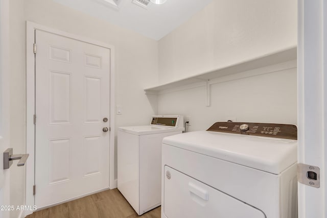 7685 W San Miguel Ave, Glendale, AZ 85303 - laundry area featuring washing machine and dryer and light wood finished floors