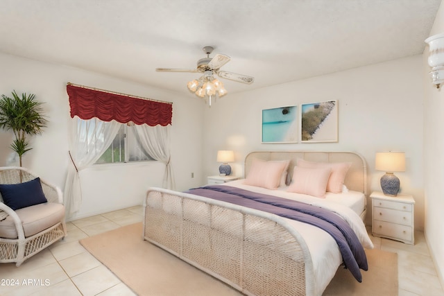 tiled bedroom with ceiling fan