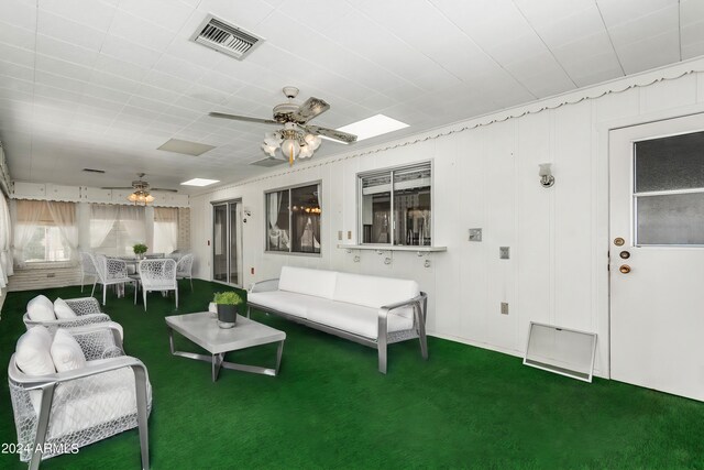 interior space with ceiling fan and outdoor lounge area