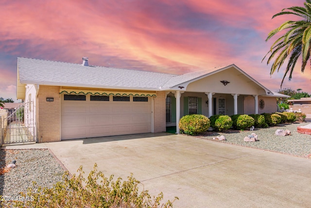 ranch-style house featuring a garage