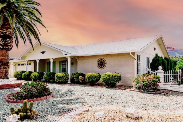 ranch-style home featuring a garage