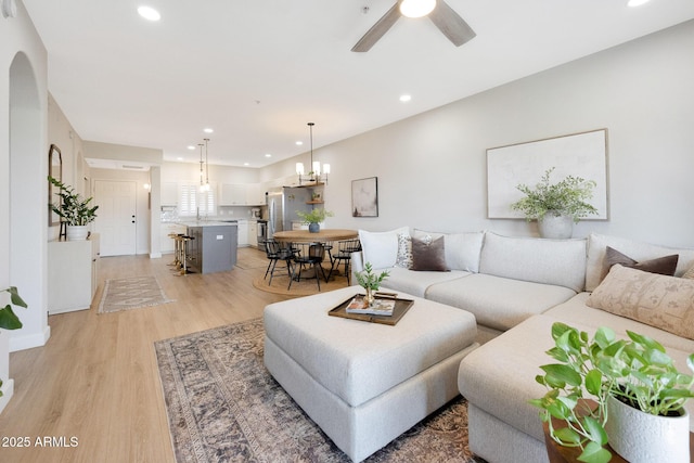 920 E Devonshire Ave Unit 4004, Phoenix, AZ 85014 - living area featuring light wood-style flooring, recessed lighting, ceiling fan, and a chandelier