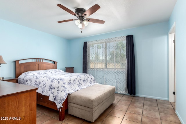 bedroom featuring light tile patterned flooring, ceiling fan, and baseboards