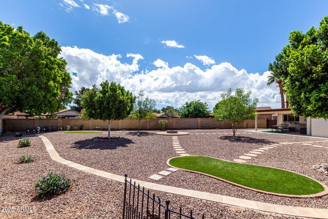 view of yard with a patio and a fenced backyard